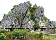 Crocodile-shaped cave in limestone mount